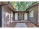 Home exterior featuring a wooden and glass front door with sidelight windows at 235 Trailmore Ct, Roswell, GA 30076