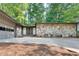 Ranch-style home with stone exterior and a two-car garage at 235 Trailmore Ct, Roswell, GA 30076