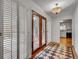 Foyer with decorative glass front door, tile, and a view into the kitchen at 235 Trailmore Ct, Roswell, GA 30076