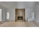 Living room with a stone fireplace and access to the outside at 235 Trailmore Ct, Roswell, GA 30076