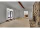Open floor plan with access to the dining room and a stone fireplace at 235 Trailmore Ct, Roswell, GA 30076