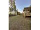 A covered porch overlooking the expansive backyard, ideal for relaxation and enjoying the outdoors at 3030 Fairway Dr, Villa Rica, GA 30180