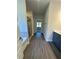 Bright bathroom featuring wood-look flooring, tub, and a glass shower at 3030 Fairway Dr, Villa Rica, GA 30180