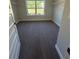 Walk-in closet with shelving and a window providing natural light at 3030 Fairway Dr, Villa Rica, GA 30180