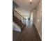 Inviting entryway with beautiful floors and staircase leading to the upper level of the home at 3030 Fairway Dr, Villa Rica, GA 30180