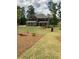 Traditional two-story home with a well-manicured lawn and attractive landscaping at 3030 Fairway Dr, Villa Rica, GA 30180