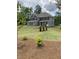 Charming two-story home with landscaped yard and traditional architectural details at 3030 Fairway Dr, Villa Rica, GA 30180