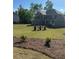 Traditional two-story home with a well-manicured lawn and attractive landscaping at 3030 Fairway Dr, Villa Rica, GA 30180