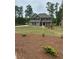 Traditional two-story home with a well-manicured lawn and attractive landscaping at 3030 Fairway Dr, Villa Rica, GA 30180