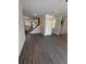 Open-concept living space showcasing stylish flooring, staircase and a view of the front door at 3030 Fairway Dr, Villa Rica, GA 30180