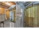 Unfinished basement with water heaters and utilities, offering potential for various uses at 201 Beacon Cv, Canton, GA 30114