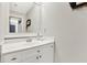 Clean and bright bathroom with white vanity, mirror and fixtures at 201 Beacon Cv, Canton, GA 30114