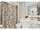 Bathroom featuring a decorative shower curtain, vanity and toilet at 201 Beacon Cv, Canton, GA 30114