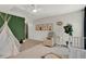 Bright bedroom with neutral tones, teepee and unique decor elements creating a playful and imaginative space at 201 Beacon Cv, Canton, GA 30114