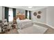 Bright bedroom with a cozy armchair, plush rug, and tasteful decor creating a relaxing retreat at 201 Beacon Cv, Canton, GA 30114