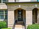 Charming front entrance with brick archway and decorative wreath on a stylish front door at 201 Beacon Cv, Canton, GA 30114