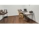 Comfortable home office area with light walls, dark floors, and a functional desk setup at 201 Beacon Cv, Canton, GA 30114