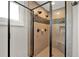 Custom tiled shower with dual shower heads, built-in bench and glass door at 201 Beacon Cv, Canton, GA 30114