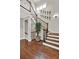 Elegant staircase with dark wood floors and stylish decor, creating a warm and inviting atmosphere at 201 Beacon Cv, Canton, GA 30114