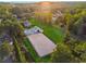 Expansive property with horse riding area, barn, fenced pastures, and manicured lawn surrounded by mature trees at 206 Savanna Estates Ct, Canton, GA 30115