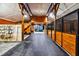 Spacious barn interior with wooden stalls, ample lighting, and a rubber floor, providing a comfortable environment for animals at 206 Savanna Estates Ct, Canton, GA 30115