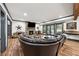 Basement area with stone fireplace, TV, hardwood floors, and comfortable seating area at 206 Savanna Estates Ct, Canton, GA 30115