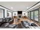 Basement area with stone fireplace, TV, hardwood floors, and comfortable seating area at 206 Savanna Estates Ct, Canton, GA 30115