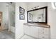Bathroom featuring a white vanity with granite counters, wood-look floors and updated fixtures at 206 Savanna Estates Ct, Canton, GA 30115