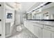 Elegant bathroom featuring dual vanities, a glass shower, and tiled flooring at 206 Savanna Estates Ct, Canton, GA 30115