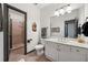 Bathroom with a walk-in shower and white vanity with modern fixtures and neutral tile at 206 Savanna Estates Ct, Canton, GA 30115