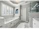 Elegant bathroom featuring a tub, glass shower, and tiled flooring at 206 Savanna Estates Ct, Canton, GA 30115