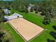 Aerial shot of horse training facility with large sand surface and metal light fixtures at 206 Savanna Estates Ct, Canton, GA 30115