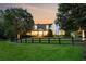 Charming two-story home featuring manicured lawn, mature trees, and a welcoming front porch in a serene, picturesque setting at 206 Savanna Estates Ct, Canton, GA 30115