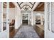 Grand foyer featuring dark wood floors, white walls, and a unique wood ceiling at 206 Savanna Estates Ct, Canton, GA 30115