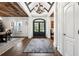 Stunning foyer with hardwood floors, white wainscoting, and wood beam ceiling at 206 Savanna Estates Ct, Canton, GA 30115