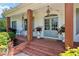 Charming front porch with brick steps, wooden columns and blue door at 206 Savanna Estates Ct, Canton, GA 30115