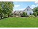 Beautifully landscaped front yard with a charming two-story home and lush greenery at 206 Savanna Estates Ct, Canton, GA 30115