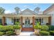 Charming front porch adorned with potted plants, rocking chairs, and decorative lanterns at 206 Savanna Estates Ct, Canton, GA 30115