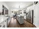 Modern kitchen with a center island, stainless appliances, white cabinets, and view of breakfast nook at 206 Savanna Estates Ct, Canton, GA 30115