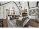 Bright living room with high ceilings, fireplace, and seamless flow to other living areas at 206 Savanna Estates Ct, Canton, GA 30115
