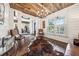 Inviting living room showcasing hardwood floors, white walls, and wood ceiling at 206 Savanna Estates Ct, Canton, GA 30115