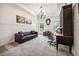 Sitting room with built-in lighting, large windows, and a leather couch at 206 Savanna Estates Ct, Canton, GA 30115