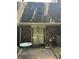 Brick-clad home with a sliding glass door leading to outdoor table seating at 3117 Reeves Se St, Smyrna, GA 30080