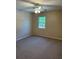 Cozy bedroom with carpet flooring, natural light, and a ceiling fan at 3117 Reeves Se St, Smyrna, GA 30080