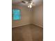 Bedroom featuring a ceiling fan, neutral walls, carpet and a window at 3117 Reeves Se St, Smyrna, GA 30080