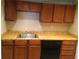 Kitchen featuring wooden cabinets, laminate countertops, and stainless steel sink at 3117 Reeves Se St, Smyrna, GA 30080
