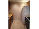 Galley kitchen featuring wood cabinets and tile flooring at 3117 Reeves Se St, Smyrna, GA 30080