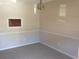 Cozy living room featuring neutral paint and carpet with a pass through window to the kitchen at 3117 Reeves Se St, Smyrna, GA 30080
