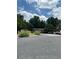 Community parking lot with ample spaces, surrounded by trees and greenery, offering convenient resident parking at 3117 Reeves Se St, Smyrna, GA 30080