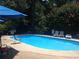 Community pool area featuring lounge chairs and a grill at 3117 Reeves Se St, Smyrna, GA 30080
